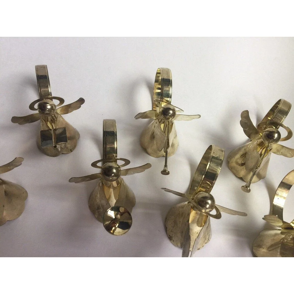 Set of 8 vintage napkin rings trumpet singing drums and candle